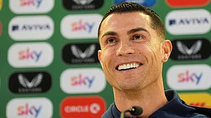 | Photo: Brian Lawless/PA via AP : Portugal's Cristiano Ronaldo speaks during a press conference in Dublin, Ireland, ahead of Thursday's World Cup qualifying soccer match against Ireland.