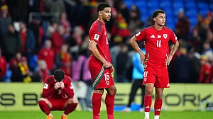 | Photo: David Davies/PA via AP : World Cup Qualifier Soccer Match: Wales vs Belgium