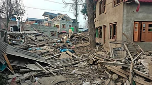 PTI : Debris at the site after the house of Dr Umar Nabi, who drove the explosive-laden car involved in the Delhi blast, was demolished by security forces, in Jammu and Kashmirs Pulwama district, Friday, Nov. 14, 2025. The demolition was carried out during the intervening night of Thursday and Friday, according to officials.