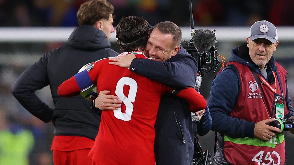 Wales boss Craig Bellamy with hat-trick scorer Harry Wilson
