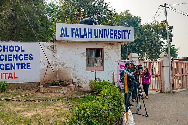| Photo: PTI : Media persons outside the Al Falah School of Medical Sciences and Research Centre, in Faridabad, Haryana. The Enforcement Directorate on Tuesday launched searches against the Al Falah University of Faridabad and linked persons as part of its investigation related to the Delhi blast case.