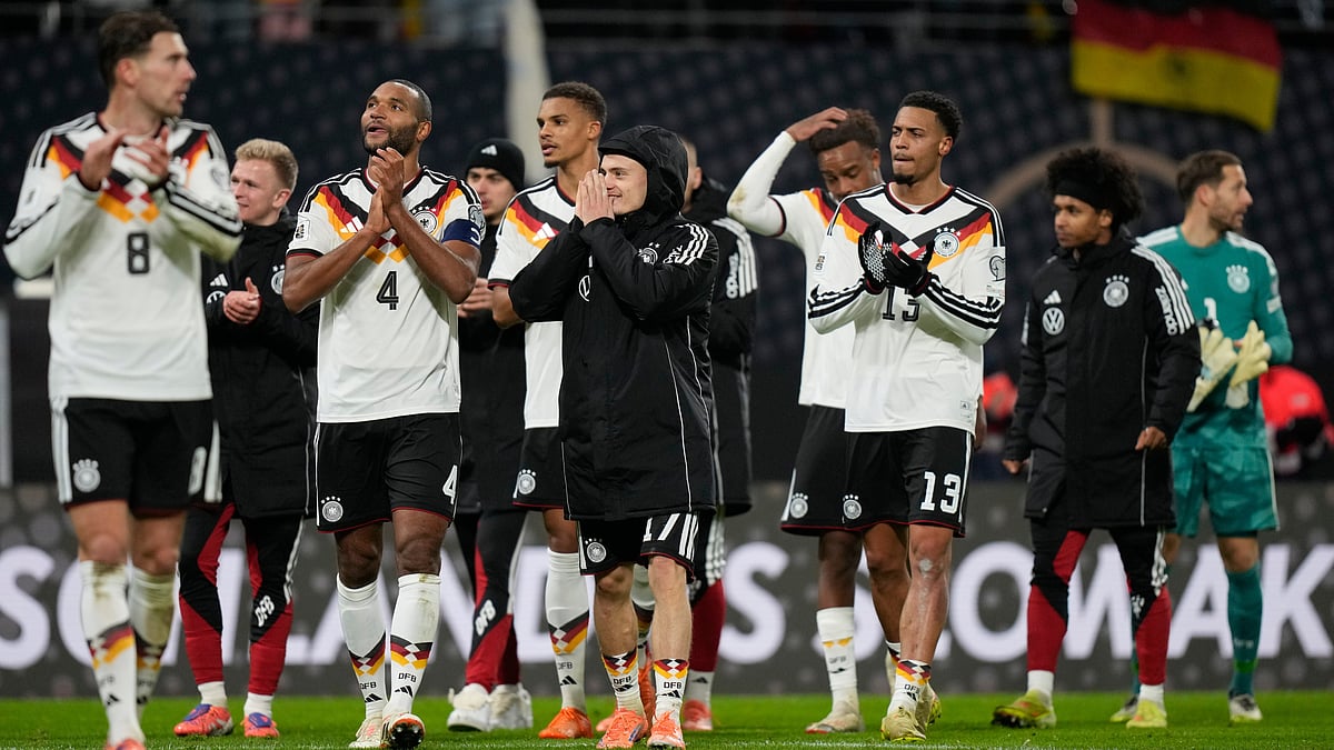 | Photo: AP/Matthias Schrader : Germany players celebrate qualifying for the FIFA World Cup 2026 after beating Slovakia in Leipzig on Monday, November 17, 2025.