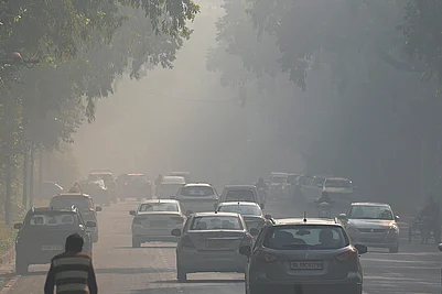 | Photo: PTI/Karma Bhutia : Vehicles ply on a road amid smog as air quality remains in the ‘poor’ category, near Kartavya Path in New Delhi.