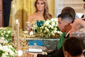 | Photo: AP/Alex Brandon : Soccer player Cristiano Ronaldo, right, listens as President Donald Trump speaks during a dinner for Saudi Arabia's Crown Prince Mohammed bin Salman in the East Room of the White House in Washington.