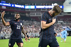 | Photo: AP/Jason Behnken : United States' Mark McKenzie (22) and Tanner Tessman celebrate Tessmann's goal during the second half of an international friendly soccer game against Uruguay in Tampa, Fla.