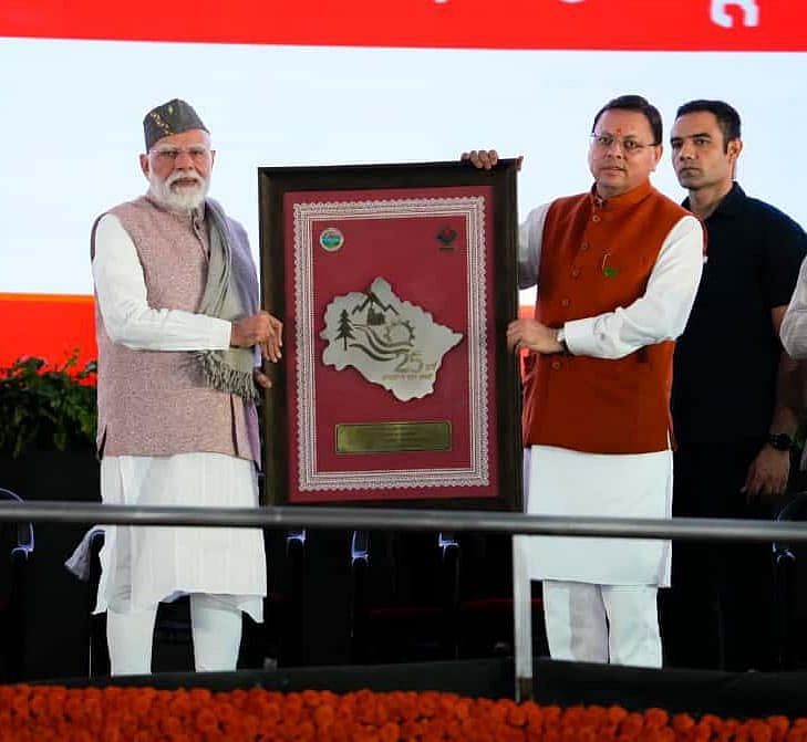 Prime Minister Narendra Modi is seen with Uttarakhand Chief Minister Pushkar Singh Dhami during the states Silver Jubilee celebrations in Dehradun.
