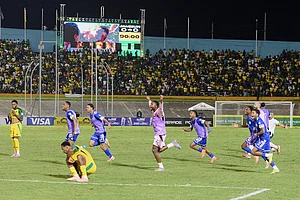 | Photo: AP/Collin Reid : Curaçao players celebrate qualifying for the 2026 FIFA World Cup after a soccer match against Jamaica in Kingston, Jamaica.