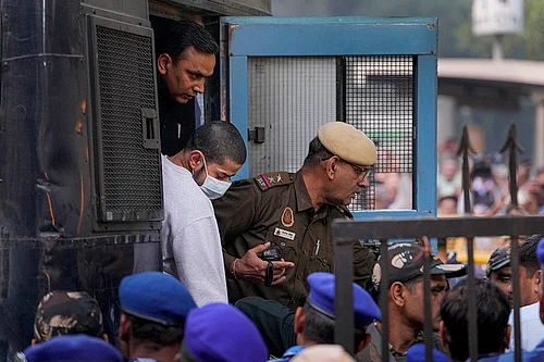| Photo: PTI/Ravi Choudhary : Gangster Anmol Bishnoi, wanted in connection with the killing of NCP leader Baba Siddique, being brought to the Patiala House Court, after he was deported to India from the US, in New Delhi.