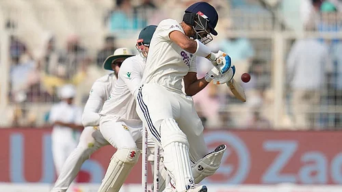 | Photo: AP/Aijaz Rahi : Indias Axar Patel plays a shot on the second day of the first cricket test match between India and South Africa in Kolkata.