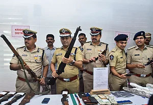 PTI : ADGP (Intelligence) Mahesh Chandra Laddha with other officials shows recovered arms and ammunitions during a press conference, in Vijayawada