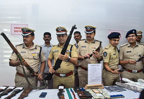 PTI : ADGP (Intelligence) Mahesh Chandra Laddha with other officials shows recovered arms and ammunitions during a press conference, in Vijayawada