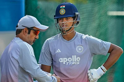 | Photo: AP/Anupam Nath : Indias chief coach Gautam Gambhir, left, talks to Yashasvi Jaiswal during a practice session at net ahead of the second test match between India and South Africa in Guwahati.