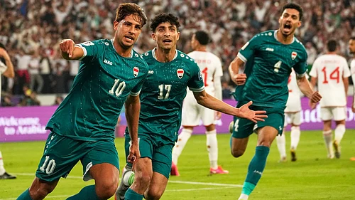 | Photo: AP/Hadi Mizban : Iraqis Mohanad Ali celebrates with teammates after scoring his sides first goal during the 2026 World Cup play off second leg match between Iraq and UAE, in Basra on Tuesday, November 18, 2025.