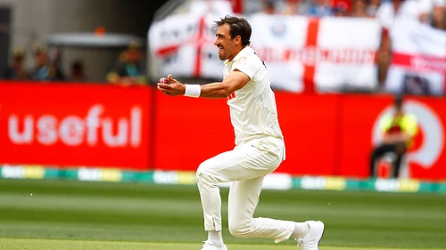 (AP Photo/Gary Day) : Australias Mitchell Starc celebrates the wicket of Englands Zak Crawley on day two of the first Ashes cricket test match between Australia and England in Perth, Saturday, Nov. 22, 2025.