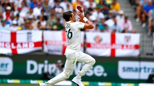 (AP Photo/Gary Day) : Australias Mitchell Starc bowls a delivery on day two of the first Ashes cricket test match between Australia and England in Perth, Saturday, Nov. 22, 2025.