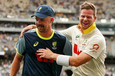 | Photo: AP/Gary Day : Australias captain Steve Smith, right, and Travis Head celebrate after winning their first Ashes cricket test match against England in Perth.