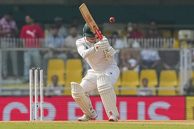 | Photo: PTI/Shahbaz Khan : South Africas Kyle Verreynne ducks the ball during the day two of the second Test cricket match of a series between India and South Africa, at ACA Stadium in Guwahati.