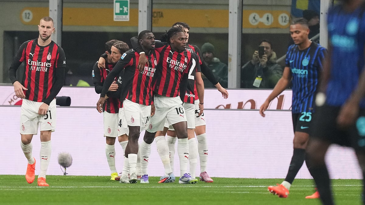| Photo: AP/Antonio Calanni : AC Milan players celebrate after scoring during the Serie A match against Inter Milan on November 23, 2025.