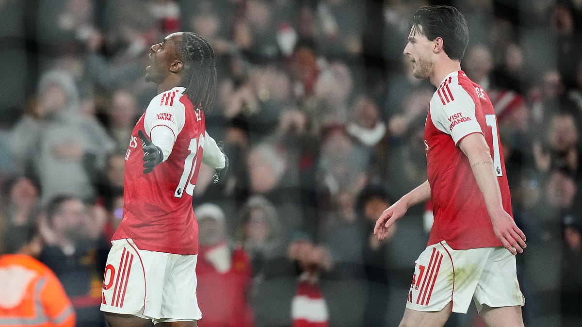 (AP Photo/Frank Augstein) : Arsenal's Eberechi Eze reacts after scoring during a Premier League soccer match between Arsenal and Tottenham in London, Sunday, Nov. 23, 2025
