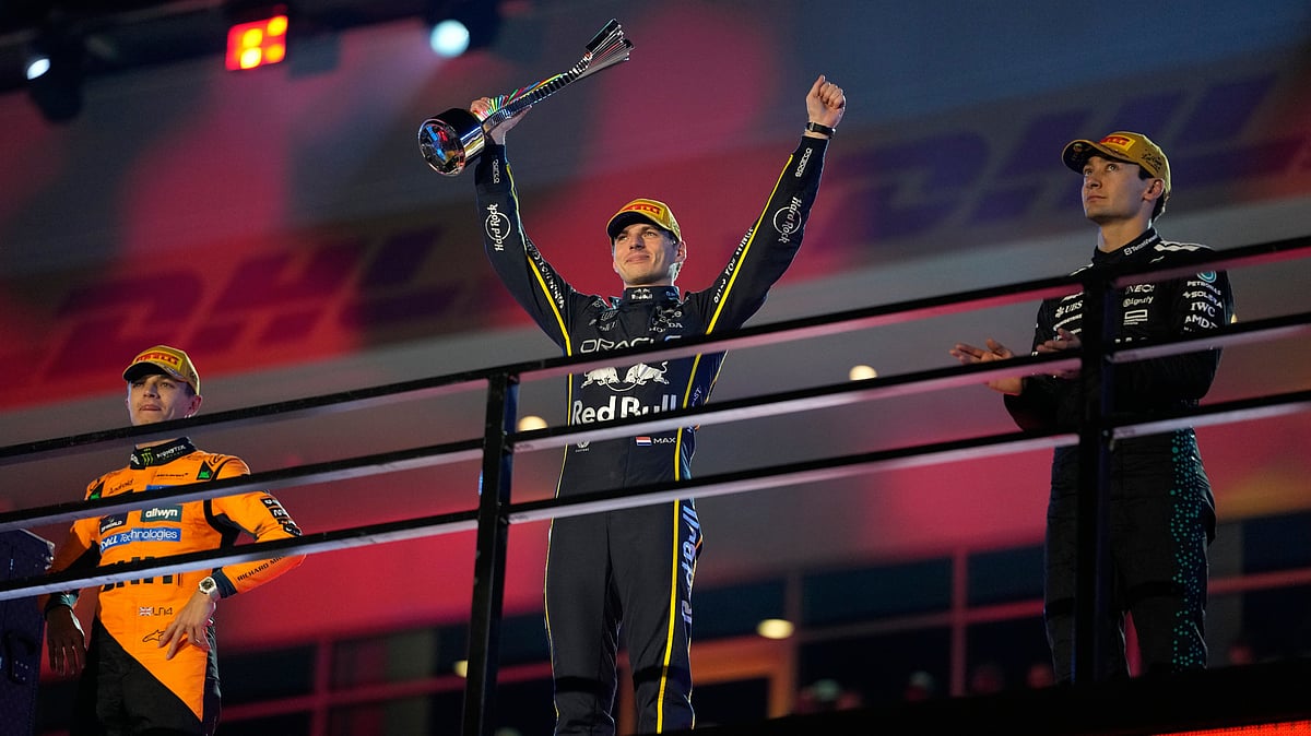 AP/John Locher : From left, second place finisher McLaren driver Lando Norris of Great Britain, first place finisher Red Bull driver Max Verstappen of the Netherlands, and third place finisher Mercedes driver George Russell of Great Britain.