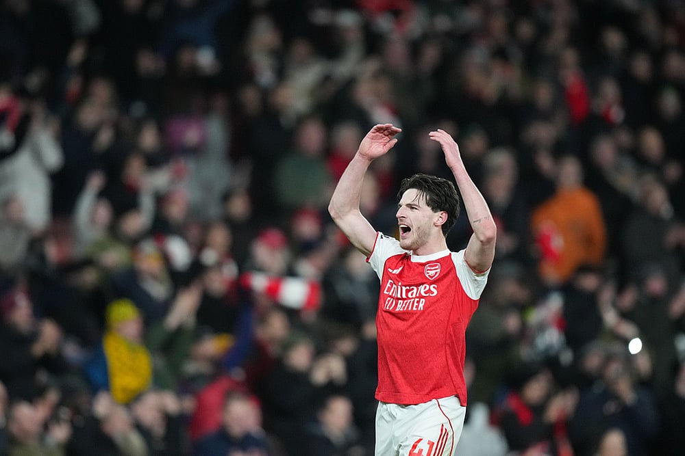| Photo: AP/Frank Augstein : Arsenal's Declan Rice celebrates after a Premier League soccer match between Arsenal and Tottenham in London.