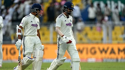 | Photo: AP/Anupam Nath : Indias KL Rahul and Yashasvi Jaiswal walk off the field at the end of the second day of the second Test match against South Africa in Guwahati on November 22, 2025.
