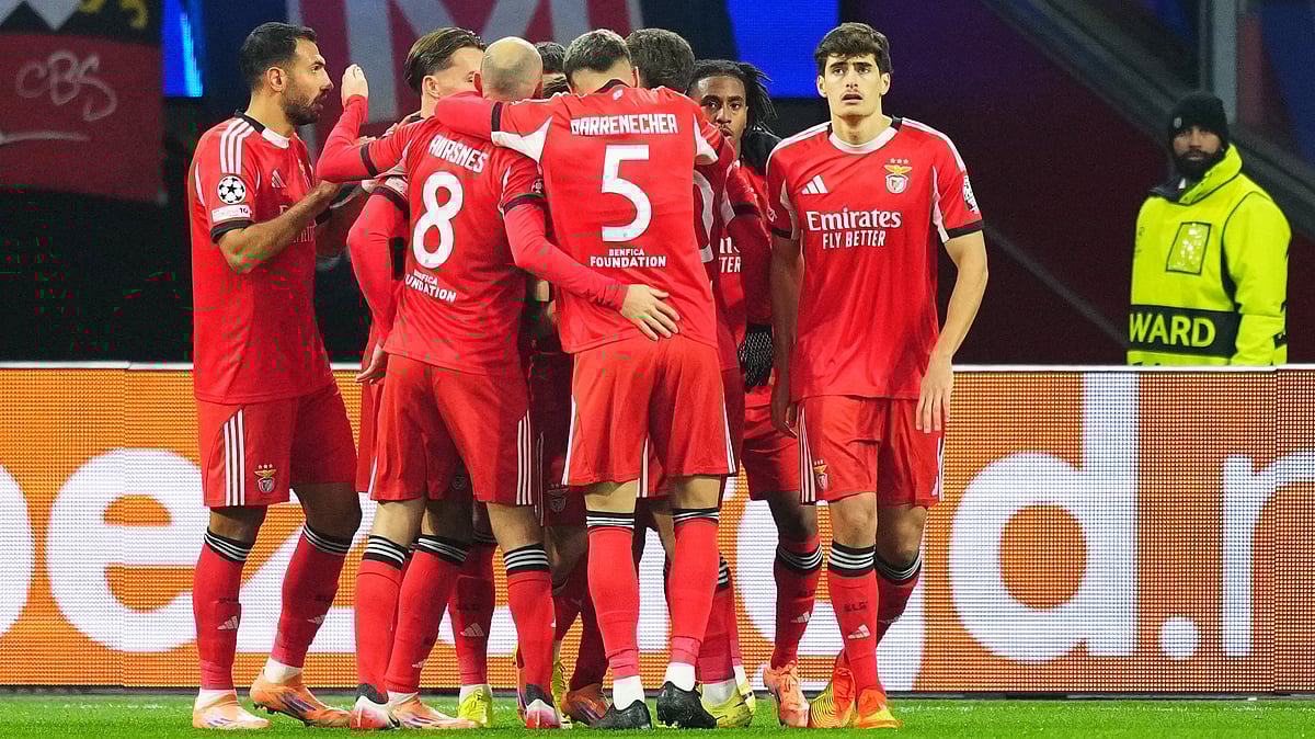 | Photo: AP/Peter Dejong : SL Benfica players celebrate after Samuel Dahl scored his side's opening goal during the UEFA Champions League opening phase match against Ajax on November 25, 2025. 