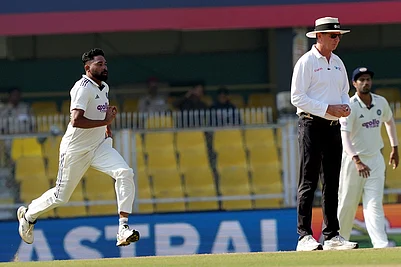 | Photo: PTI/Shahbaz Khan : Indias Mohammed Siraj bowls a delivery during the fourth day of the second Test cricket match between India and South Africa, at ACA Stadium, Barsapara in Guwahati.