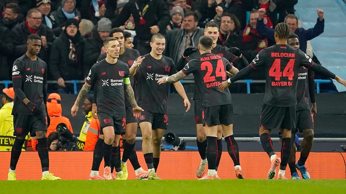 | Photo: AP/Dave Thompson : Bayer Leverkusen's Patrik Schick is congratulated by teammate Aleix Garcia, after he scored his sides second gaol during the UEFA Champions League opening phase match against Manchester City on November 25, 2025.