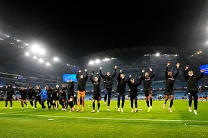 | Photo: Nick Potts/PA via AP : Bayer Leverkusen players celebrate after the Champions League opening phase soccer match between Manchester City and Bayer Leverkusen in Manchester, England.