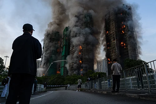 AP Photo/Chan Long Hei : Smoke rises after a fire broke out at Wang Fuk Court, a residential estate in the Tai Po district of Hong Kongs New Territories on Wednesday, Nov. 26 2025.