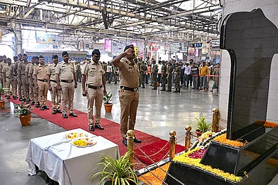 | Photo: PTI : Police personnel pay tribute to the victims of the 26/11 Mumbai terror attack on the attacks 17th anniversary, at Chhatrapati Shivaji Maharaj Terminus (CSMT) in Mumbai.