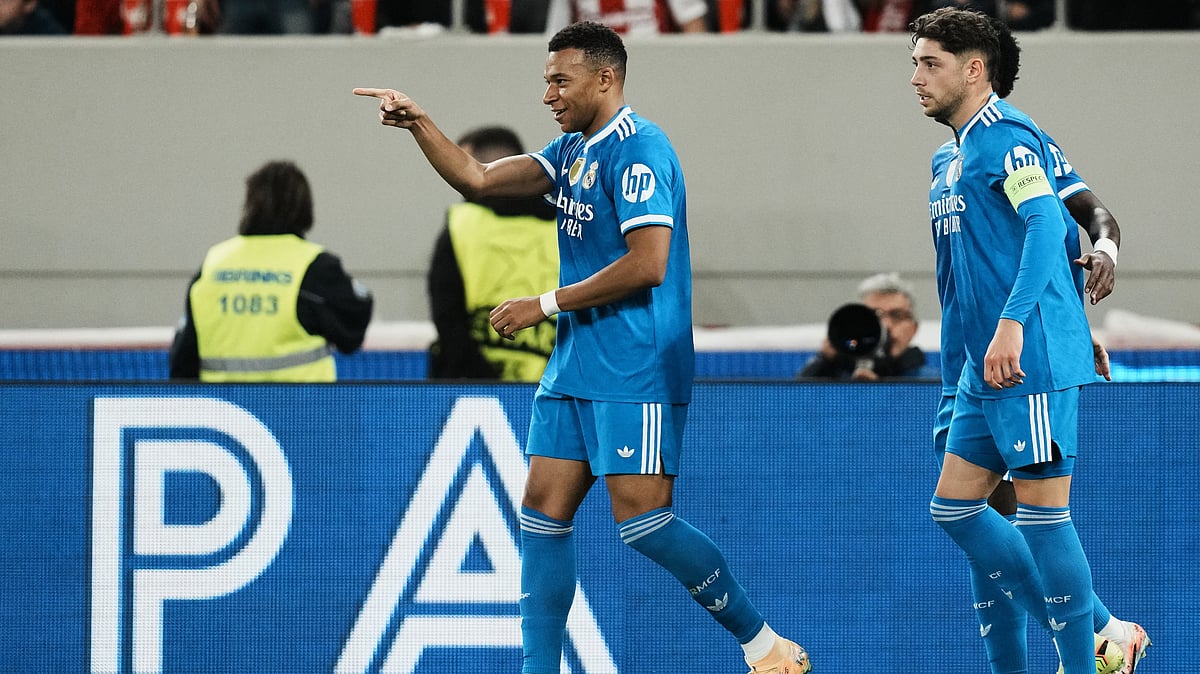 | Photo: AP/Thanassis Stavrakis : Real Madrid's Kylian Mbappe celebrates scoring his side's third goal during the UEFA Champions League opening phase match against Olympiacos on November 26, 2025.
