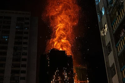 | Photo: AP/Chan Long Hei : Flames engulf a building after a fire broke out at Wang Fuk Court, a residential estate in the Tai Po district of Hong Kongs New Territories.