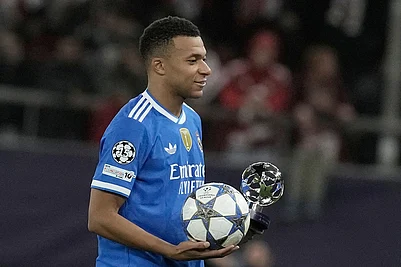 | Photo: AP/Petros Giannakouris : Real Madrids Kylian Mbappe poses with the trophy after scoring four goal during the Champions League opening phase soccer match between Olympiacos and Real Madrid, in in Piraeus port, near Athens, Greece.