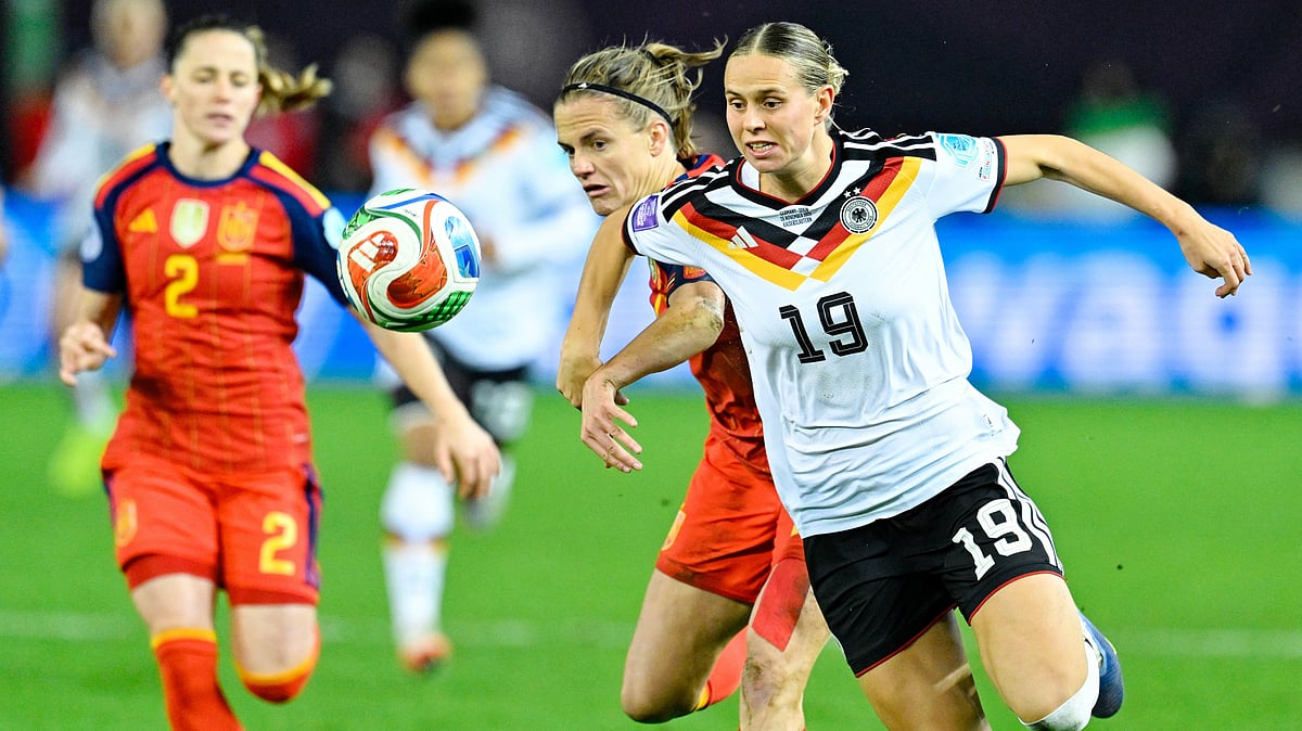 | Photo: dpa/Uwe Anspach via AP : Germany's Klara Buhl and Spain's Irene Paredes fight for the ball during the UEFA Women's Nations League match on November 28, 2025. 