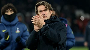 Tottenham Hotspur manager Thomas Frank applauds the fans during the UEFA Champions League match against PSG on November 27, 2025.