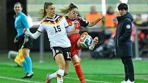 | Photo: dpa/Uwe Anspach via AP : Germany's Selina Cerci and Spain's Olga Carmona fight for the ball during the UEFA Women's Nations League match on November 28, 2025