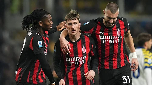 | Photo: Massimo Paolone/LaPresse via AP : AC Milans Alexis Saelemaekers, center, celebrates with Rafael Leao, left, and Strahinja Pavlovic after scoring his sides opening goal during the Serie A soccer match between Parma and Milan in Parma, Italy.