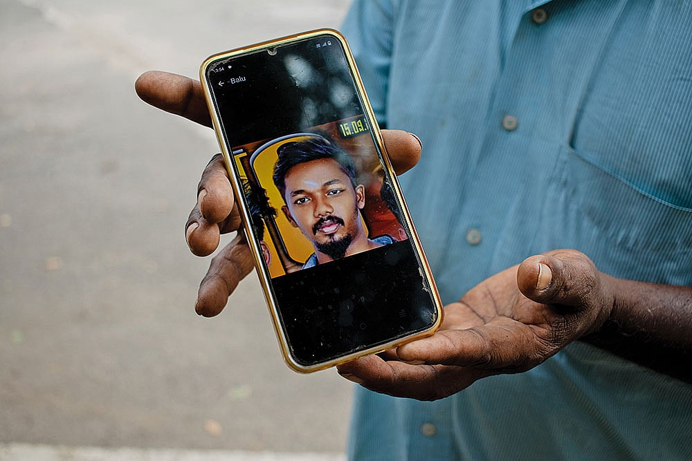 | Photo: Subash Sagar : Faces of Tragedy: Chinnakannu shows the picture of his son