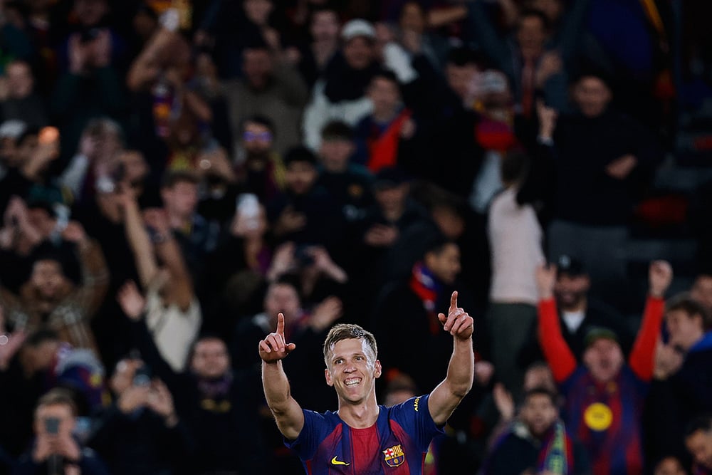 | Photo: AP/Joan Monfort : Barcelona's Dani Olmo celebrates after scoring his side's third goal during a Spanish La Liga soccer match between Barcelona and Alaves, in Barcelona, Spain.