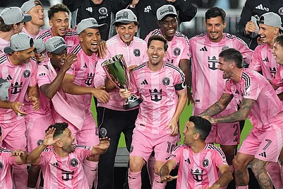 | Photo: AP/Rebecca Blackwell : Inter Miami forward Lionel Messi (10) holds the trophy as Inter Miami players celebrate winning an MLS Eastern Conference final soccer match against New York City FC, in Fort Lauderdale, Florida.