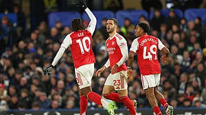 | Photo: AP/Ian Walton : Arsenal's Eberechi Eze, Mikel Merino, and Myles Lewis-Skelly during the English Premier League match against Chelsea on November 30, 2025.