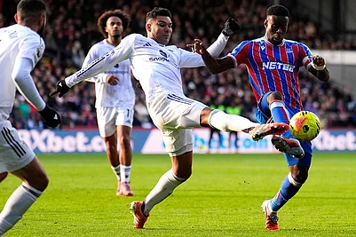 | Photo: Jordan Pettitt/PA via AP : Manchester Uniteds Casemiro and Crystal Palaces Marc Guehi, right, during the English Premier League soccer match between Crystal Palace and Manchester United in London.