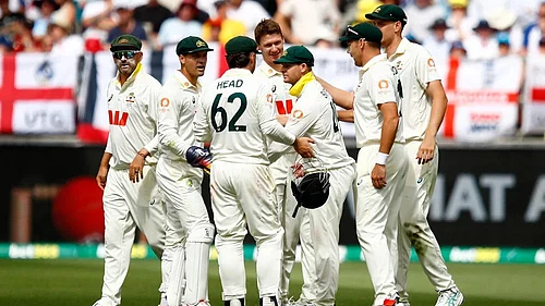 | Photo: AP/Gary Day : Australias players celebrate the wicket of Englands Jofra Archer on day two of the first Ashes cricket test match between Australia and England in Perth.
