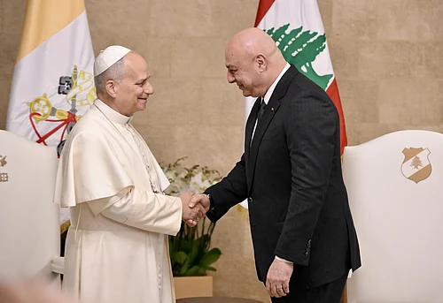 Alessandro Di Meo/Pool Via AP : Pope Leo XIV is greeted by Lebanese President Joseph Aoun upon his arrival at the Presidential Palace in Beirut, Lebanon, Sunday, Nov. 30, 2025.
