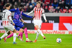 | Photo: Harry Langer/dpa via AP : Patrick Osterhage, right, of SC Freiburg scores their side's fourth goal of the game during a German Bundesliga soccer match between SC Freiburg and 1. FSV Mainz 05, in Freiburg im Breisgau, Germany.