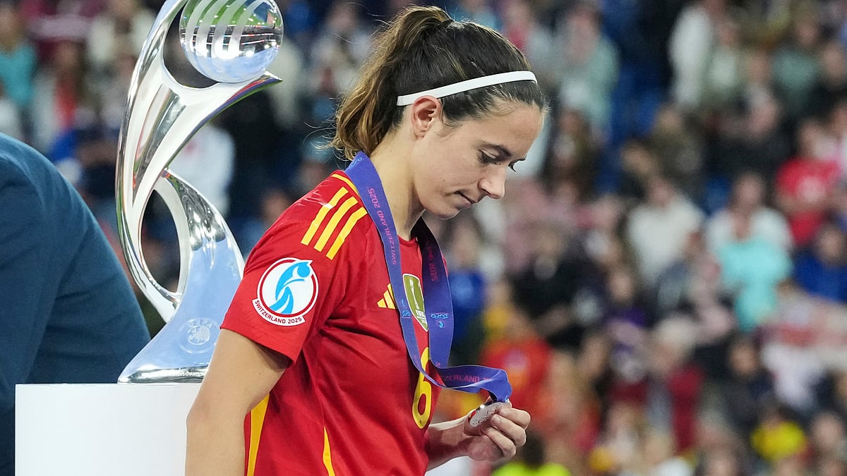 | Photo: AP/Martin Meissner : File photo of Spain's Aitana Bonmati walking past the trophy with her runners up medal after the Women's Euro 2025 final match against England on July 27, 2025.
