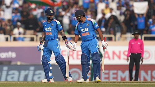 | Photo: AP/Rafiq Maqbool : Indias Virat Kohli chats with Rohit Sharma during the first ODI against South Africa in Ranchi on November 30, 2025.
