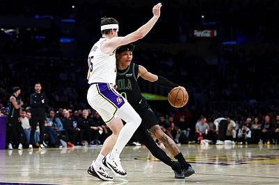 | Photo: AP/Jessie Alcheh : New Orleans Pelicans guard Jeremiah Fears, right, drives against Los Angeles Lakers guard Austin Reaves (15) during the first half of an NBA basketball game in Los Angeles.